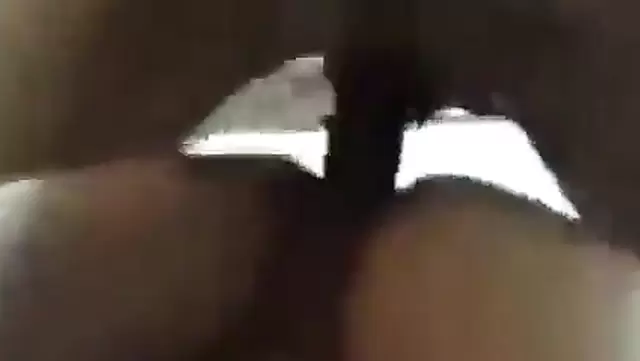 Asian woman with a cock in her pussy