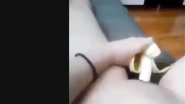 Asian girl fucks herself with a banana